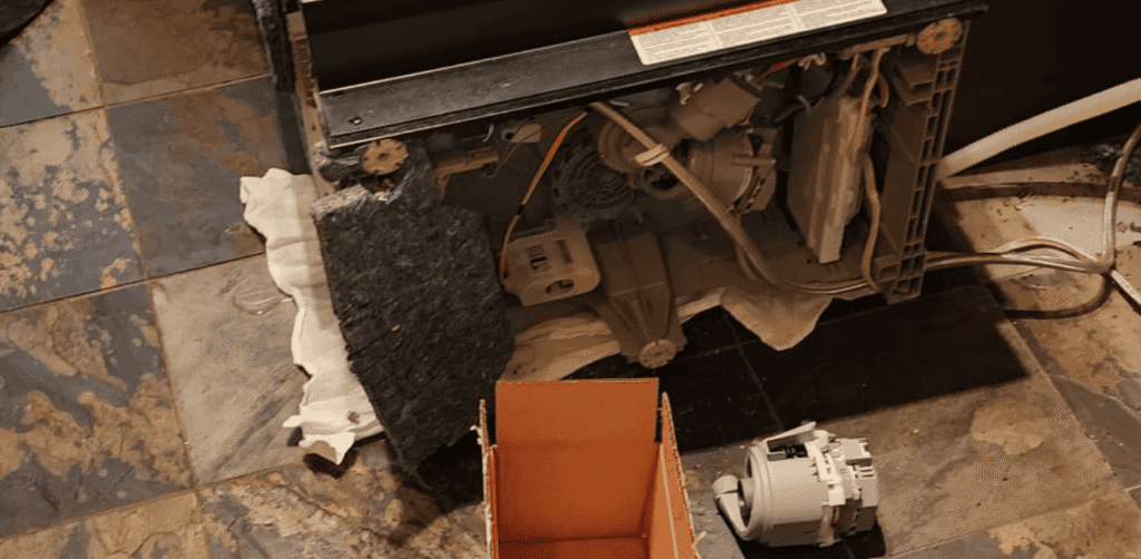 Dishwasher filter being cleaned to maintain airflow and enhance drying efficiency, ensuring dishes come out completely dry without residue.
